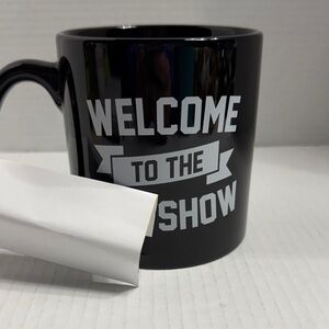 Spencer's Black Welcome to the Show Mug